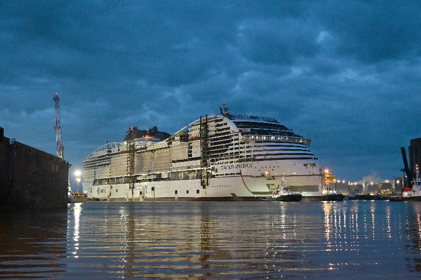 A large cruise ship in the water Description automatically generated