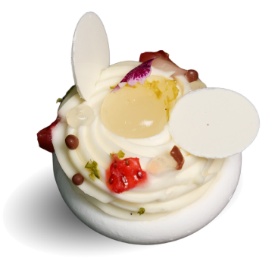 A white cake with white frosting and white eggs

Description automatically generated