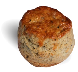 A round brown object with black specks

Description automatically generated